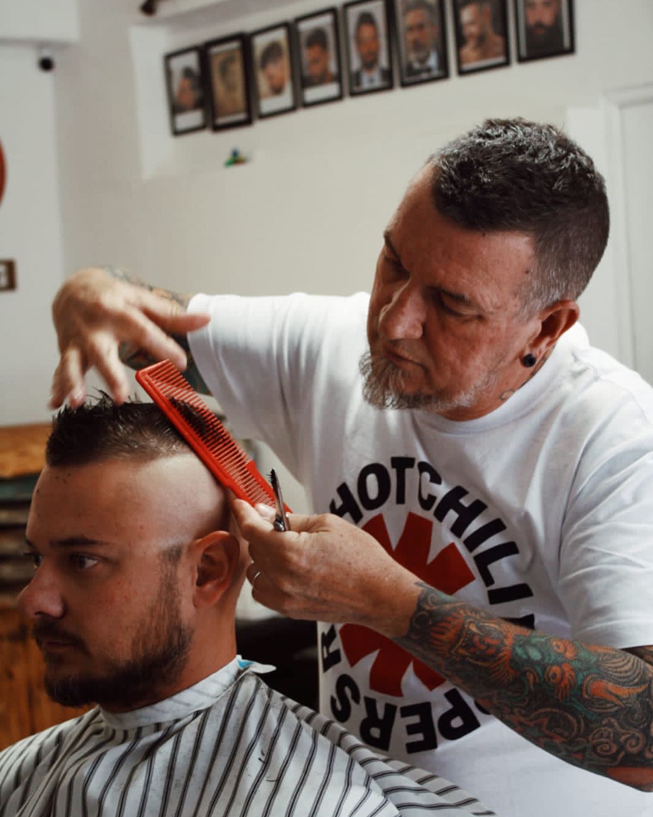 Paul cutting a client's hair